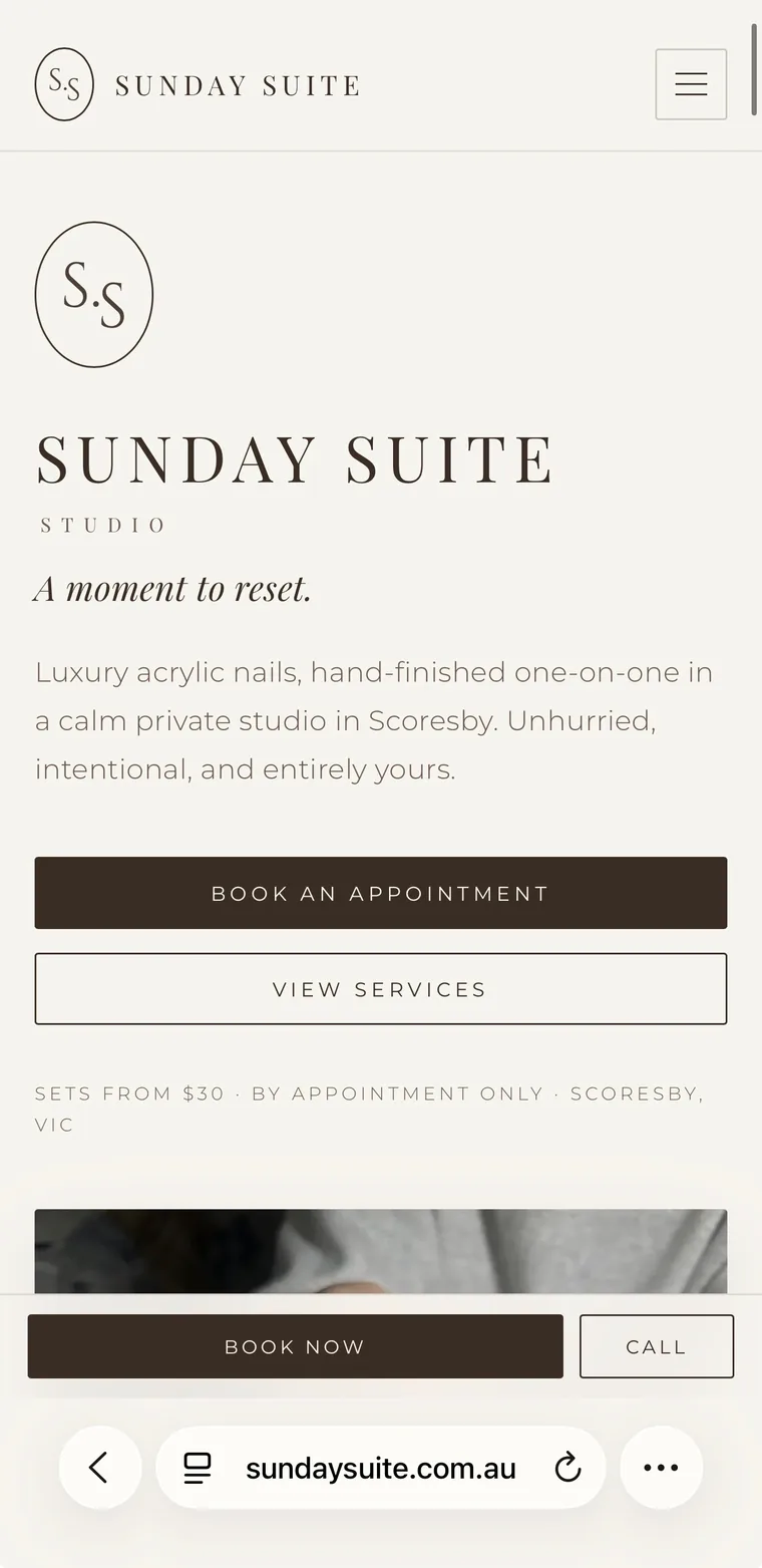 The Sunday Suite homepage on a phone: the monogram, the line A moment to reset, and Book an appointment and View services buttons